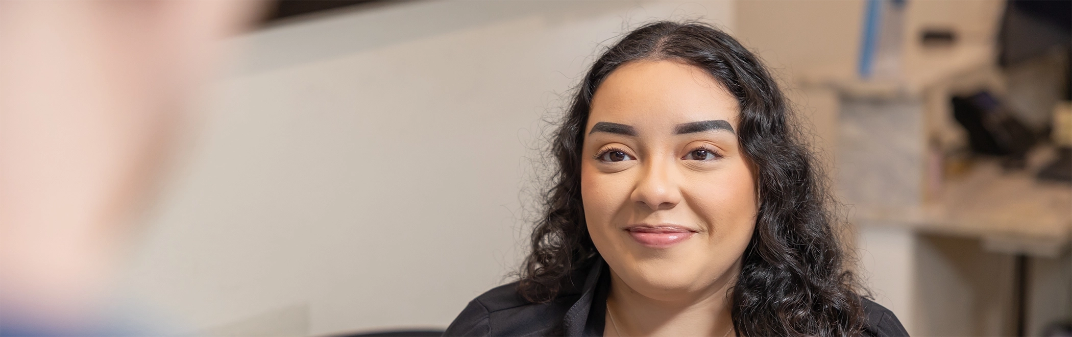 Richardson dental team member smiling at a patient