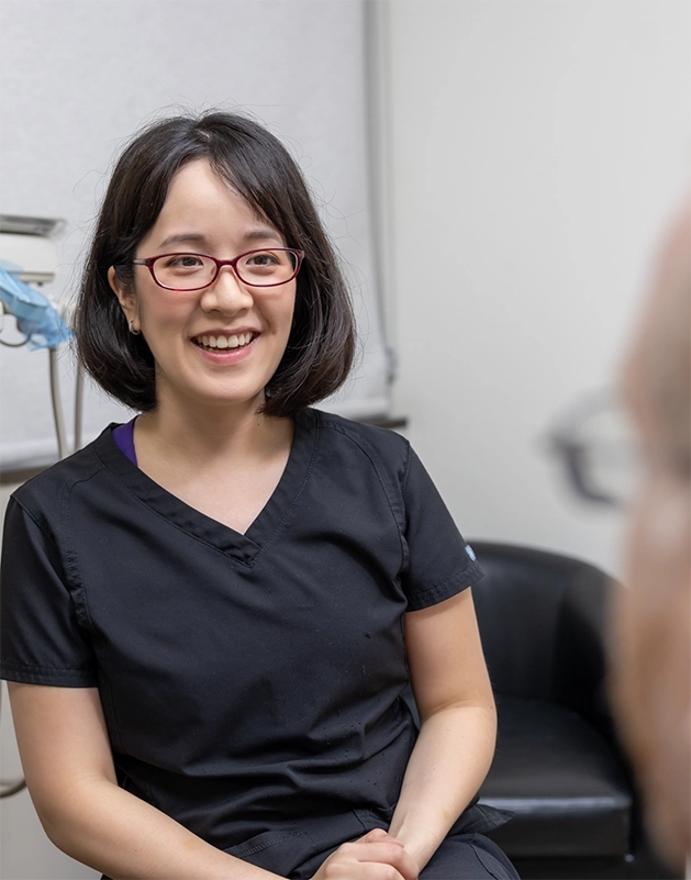 Doctor Kim Cao smiling at a patient