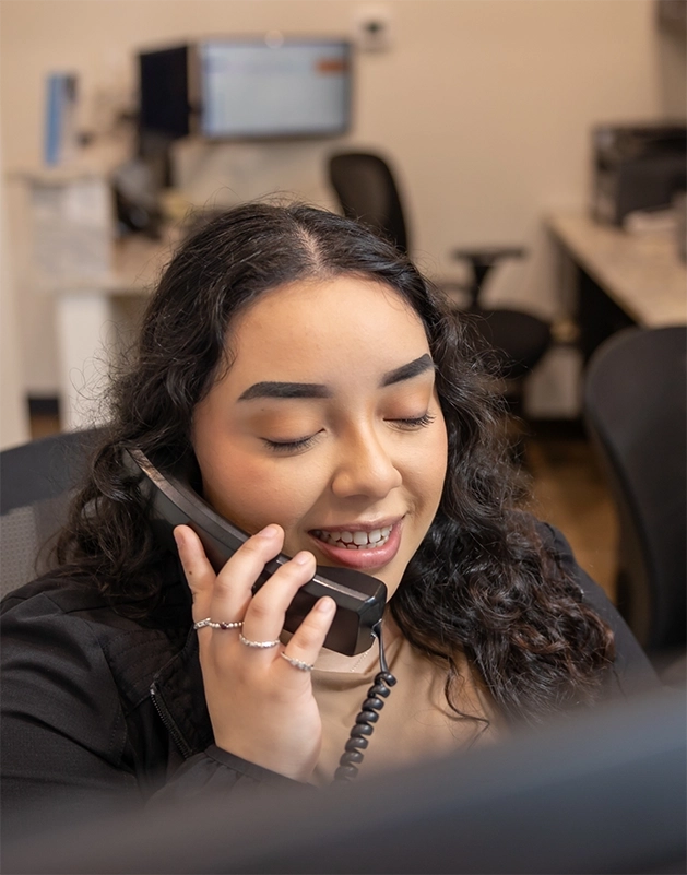 Dental team member answering the phone