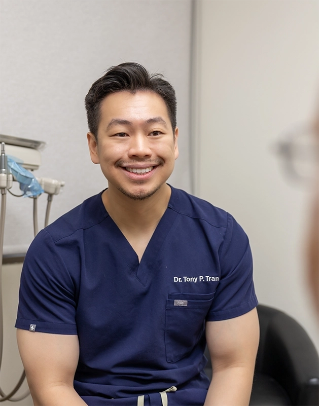Doctor Tony Tran smiling at a patient