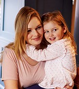 Smiling mother and daughter