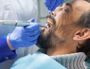 Man receiving dental crowns
