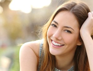 patient smiling after getting dental crown in Richardson