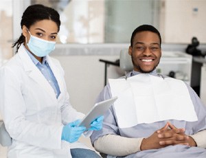 patient smiling after getting dental crown in Richardson 