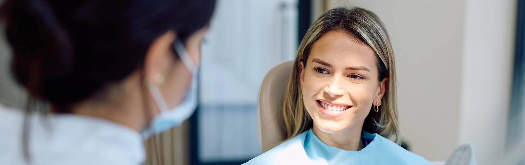 Woman smiling at her dentist