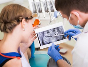 dentist showing a patient their dental X-rays