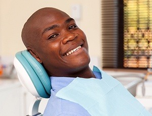 smiling man sitting in the dental chair