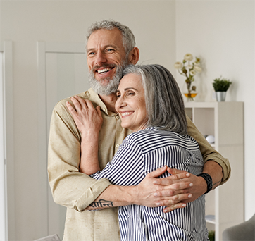 Couple hugging at home