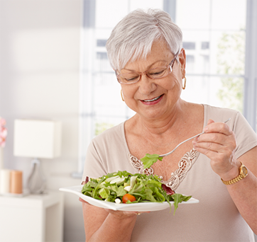 Senior woman eating a salad