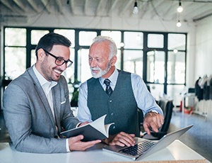 An older man working with a client