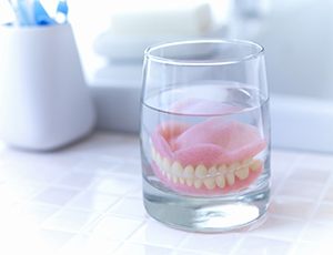 Dentures in Richardson soaking in solution
