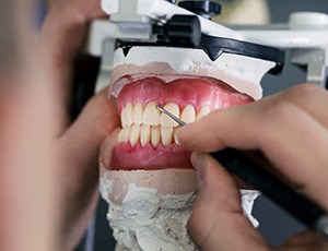 a lab technician making dentures