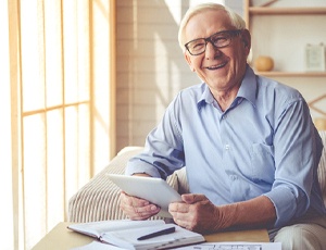 Senior man with dentures at home