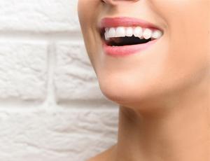 Person smiling after dental bonding treatment