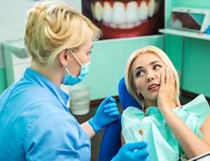 Patient listening to cost of tooth extractions in Richardson