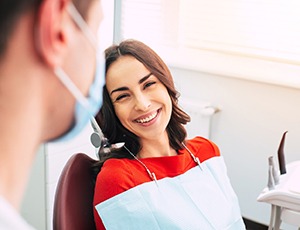 woman visiting her implant dentist near Carrollton 