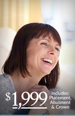 Smiling woman with text for $1999 dental implant coupon