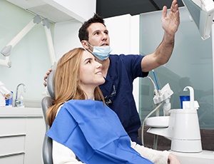 Implant dentist in Richardson speaking with a patient