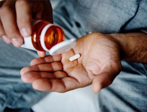 Close-up of a hand holding some medication