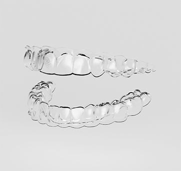 Two clear aligners against a white background