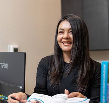 Dental team member smiling at a patient