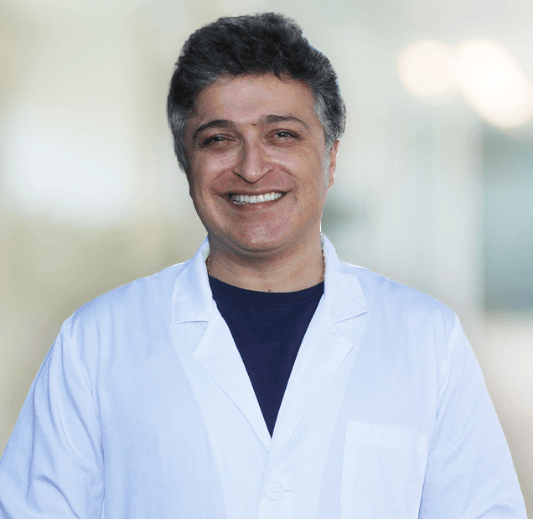 A photo of Dr. Afshin Azmoodeh smiling