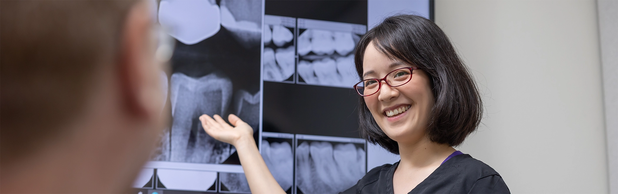 Dentist showing a patient their x-rays