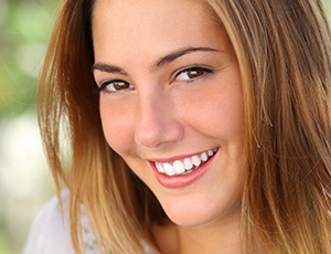 Woman with healthy smile after scaling and root planing periodontal therapy