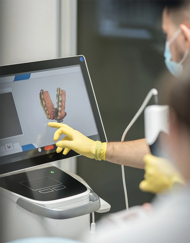 Dentist taking digital scans of a patient's teeth