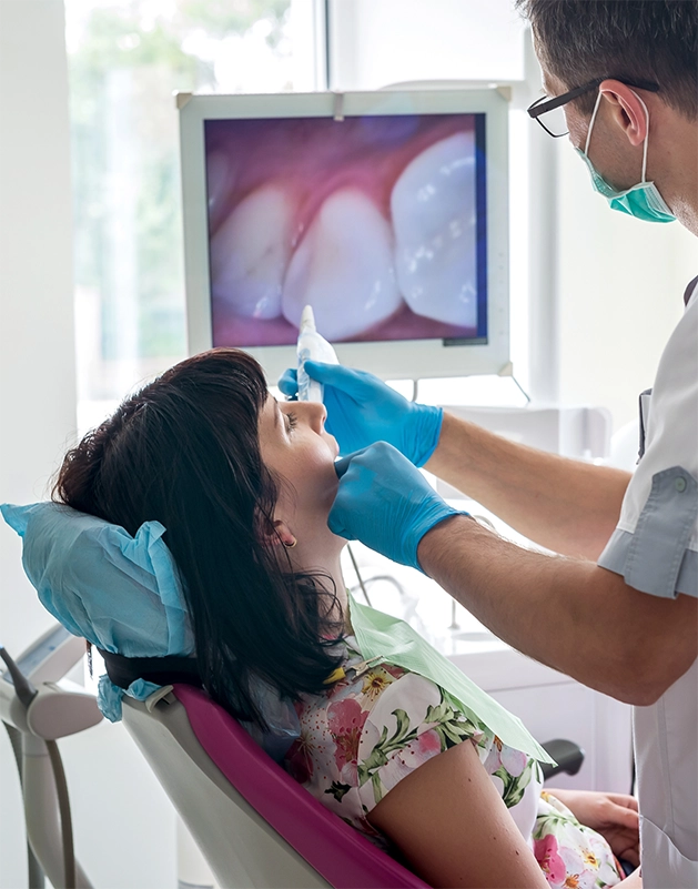 Dentist taking close up photos of a patient's teeth