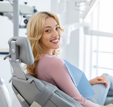 Smiling blonde woman in the dental chair