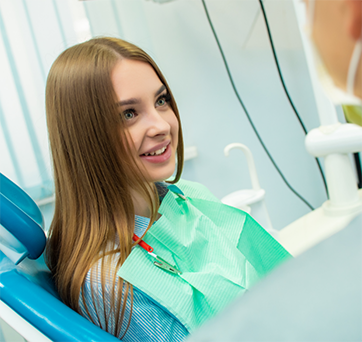 Young woman listening to her dentist