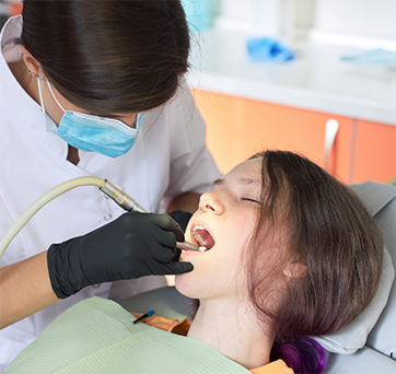 Young woman getting dental work done