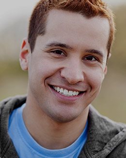 Smiling young man outdoors