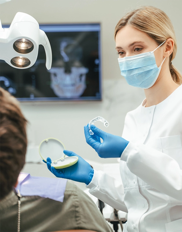 Dentist showing SureSmile to a patient