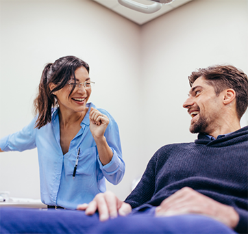 Young man chatting with his dentist