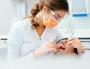 Relaxed patient receiving dental care under sedation dentistry