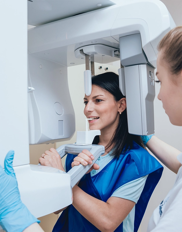 Dental patient getting a cone beam scan of her mouth