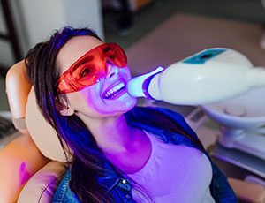 a patient receiving teeth whitening in Richardson, TX