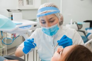 Richardson dentist in PPE provides care during COVID-19