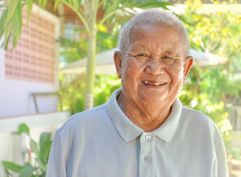 A close-up of a man with missing teeth