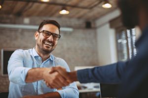 a smiling person interviewing for a job