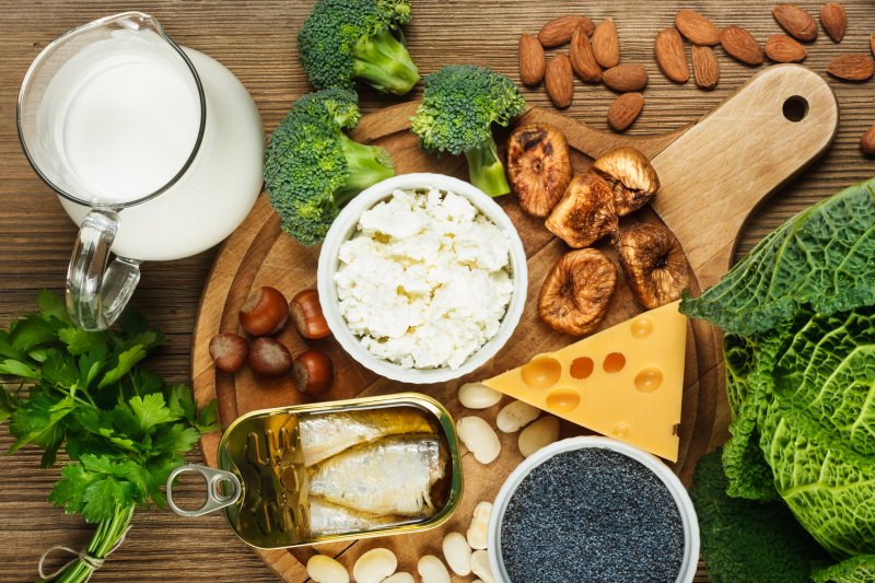 Spread of milk, leafy greens, broccoli, almonds, mushrooms, cheese, and more calcium-rich foods