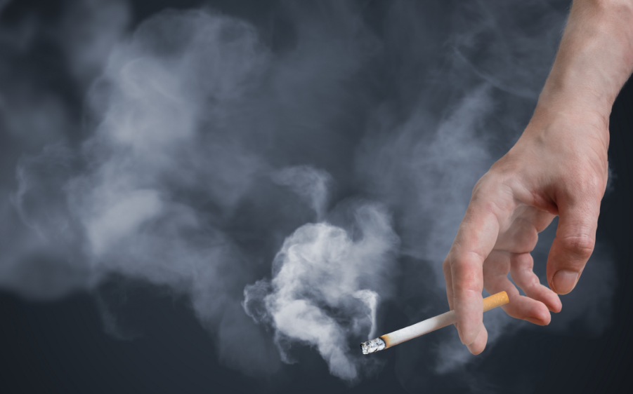 Hand holding a cigarette