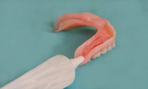 Person using denture adhesives